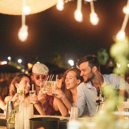 A group of friends enjoying drinks at home.