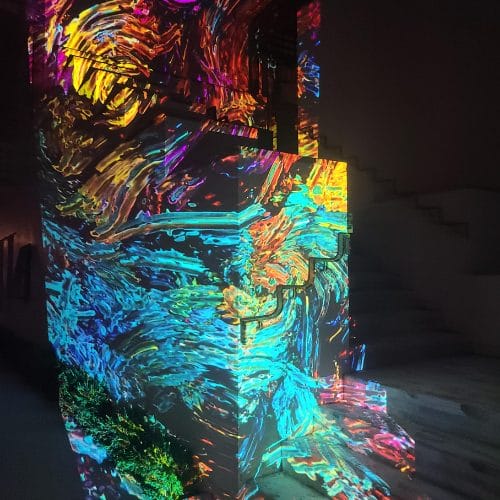 digital graffiti cast onto walls with many led colors